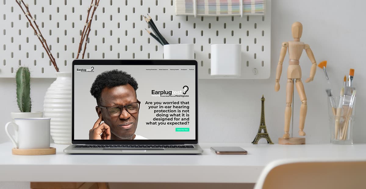 Person taking the EarplugTest with headphones
